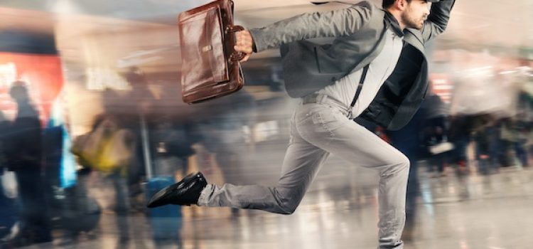 Late tourist man runs fast in airport